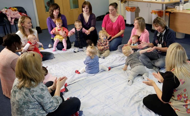Families singing during Peep group for parents and babies