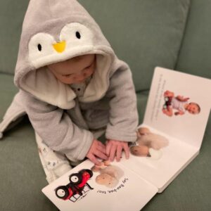 Imagination-library-baby-reading Baby enjoying their Imagination Library book
