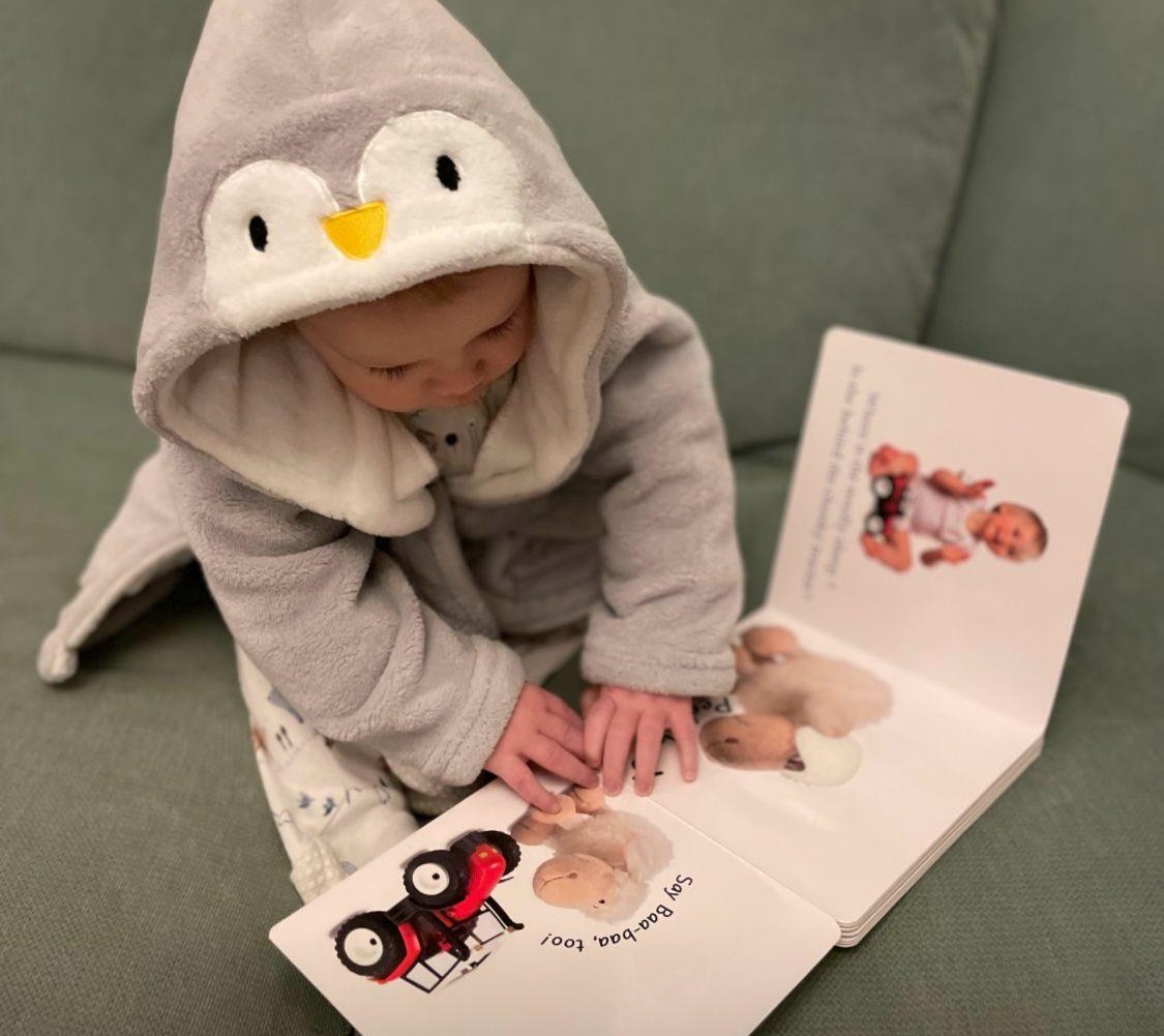 Baby enjoying their Imagination Library book