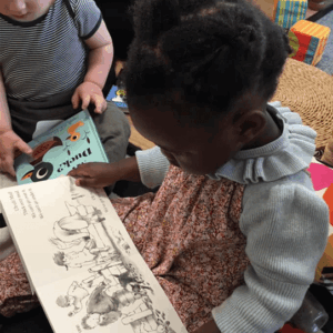 Toddlers-reading-picture-books Toddlers reading picture books