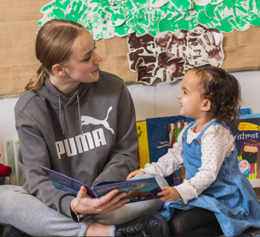 Enjoying books together in Nursery