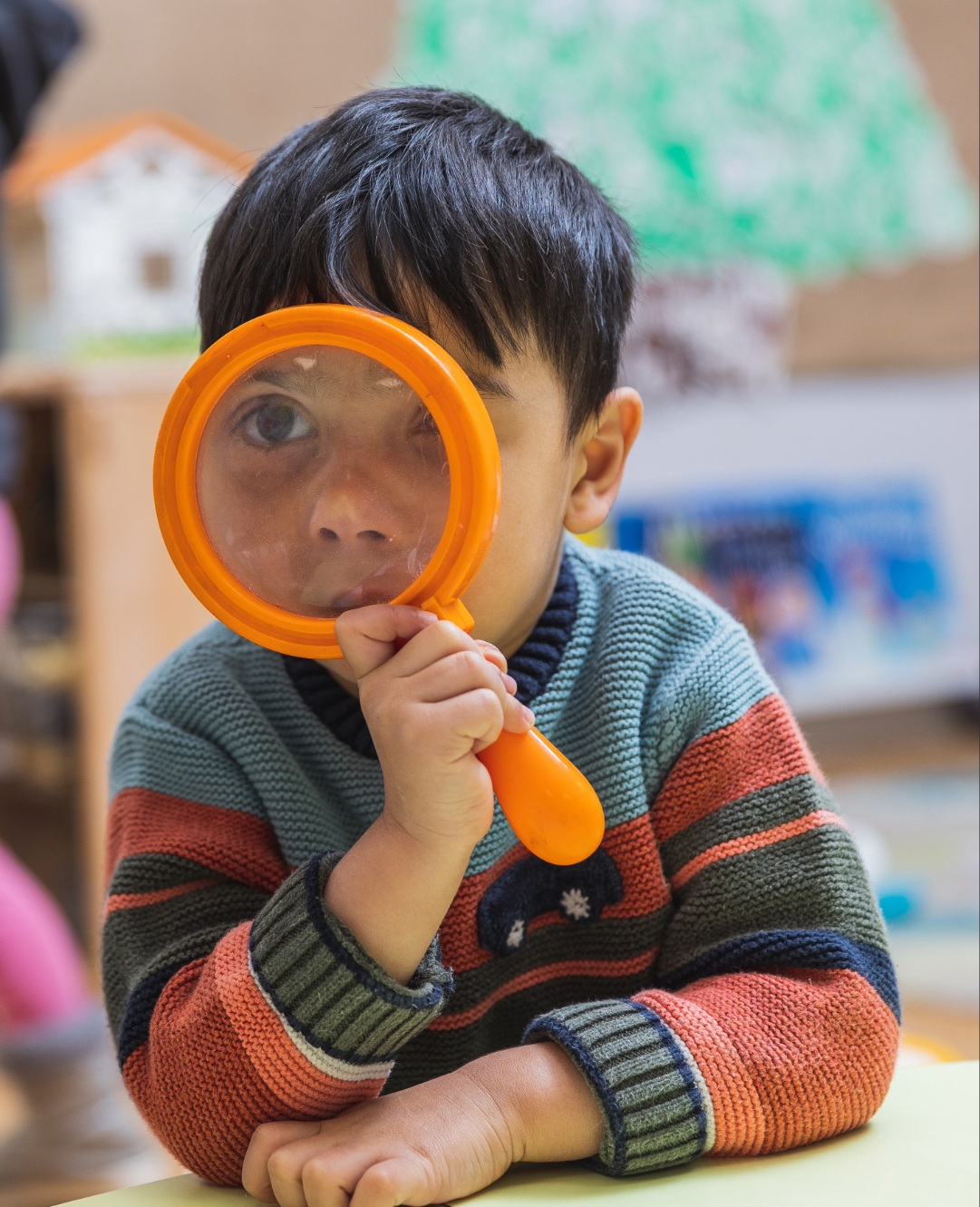 Child with magnifying glass Child with magnifying glass