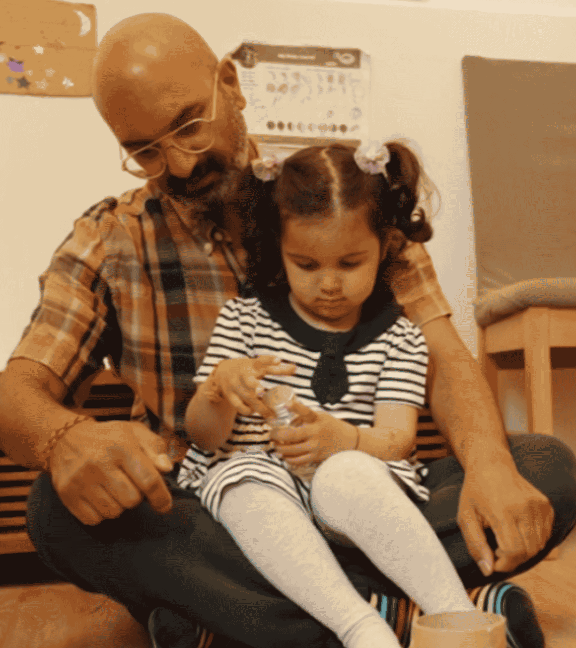 Dad and girl playing at home